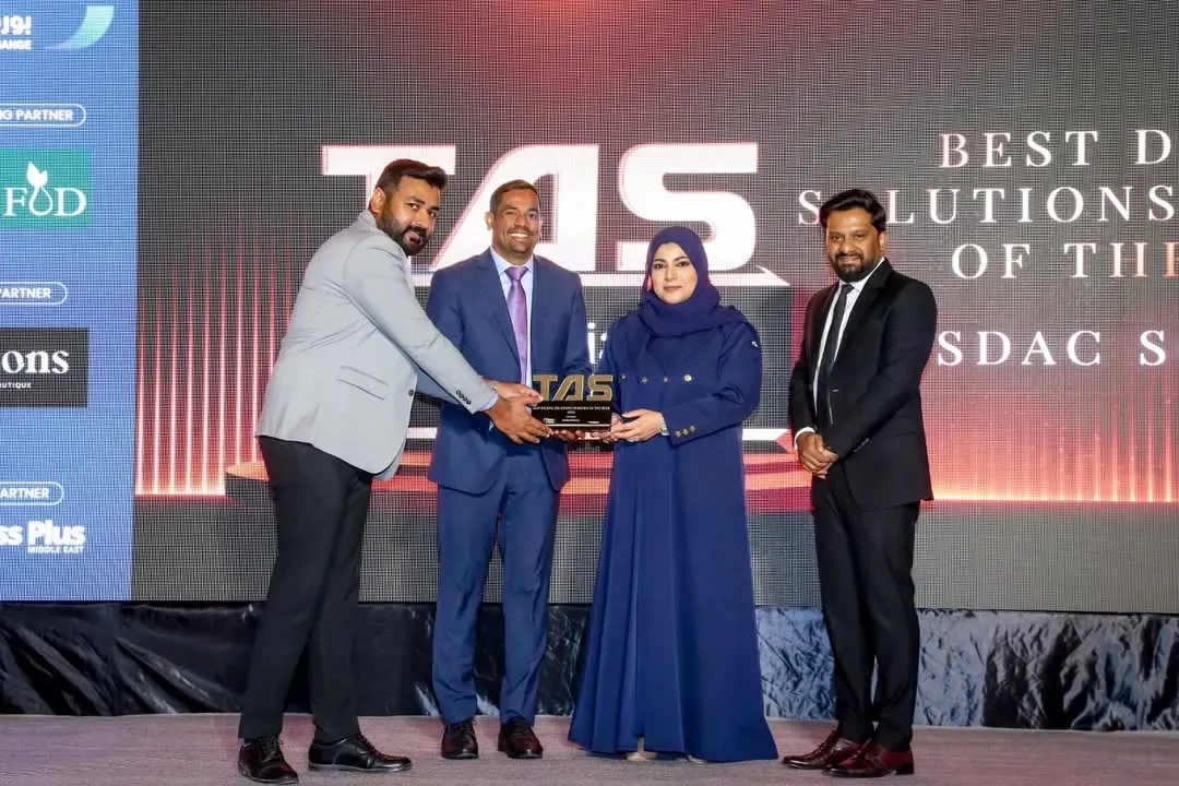 Team receiving TAS Best Digital Solutions award on stage